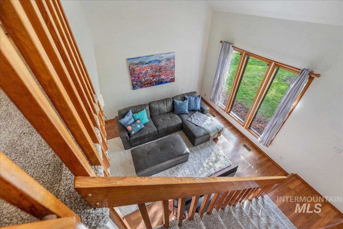 236 East Bayview Court Boise, ID 83706 - Photo 40 of 49 Living room with wood finished floors and a high ceiling