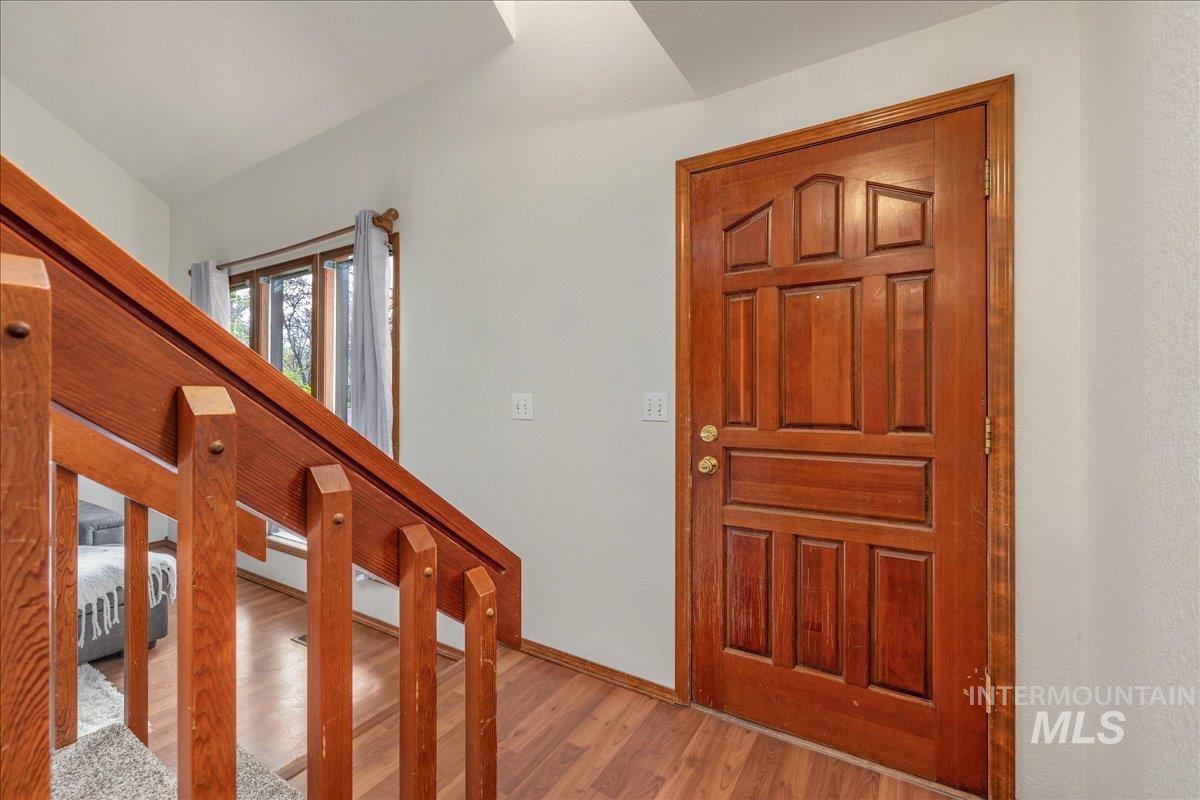 236 East Bayview Court Boise, ID 83706 - Photo 41 of 49 Foyer entrance featuring wood finished floors and baseboards