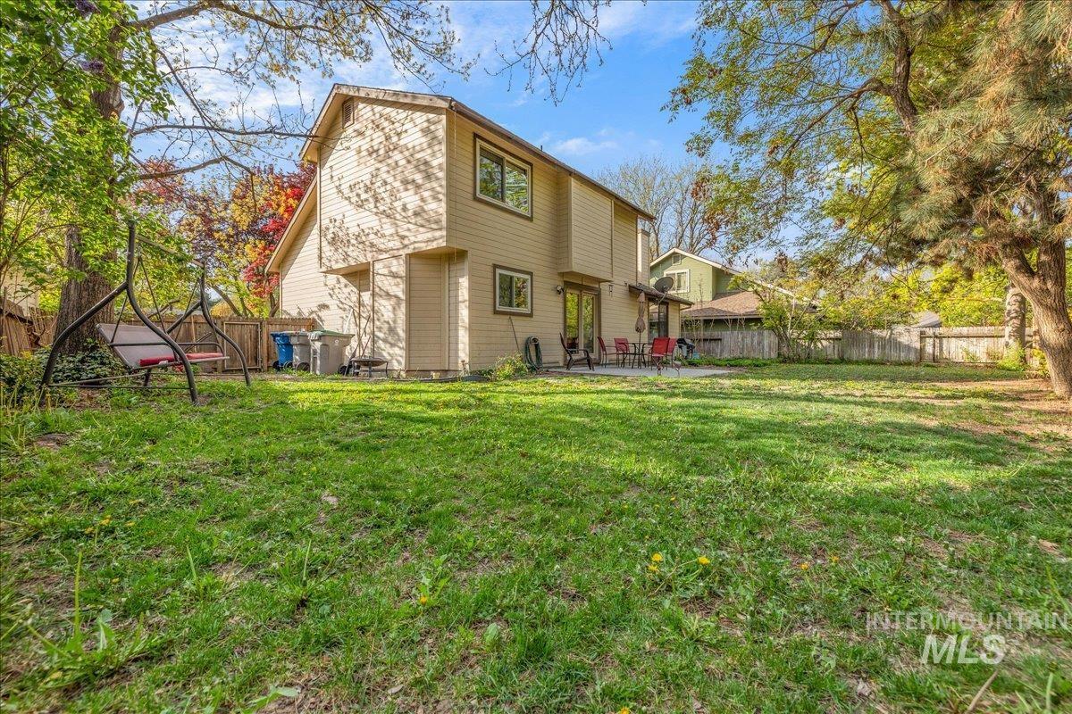 236 East Bayview Court Boise, ID 83706 - Photo 43 of 49 Rear view of property featuring a fenced backyard and a patio