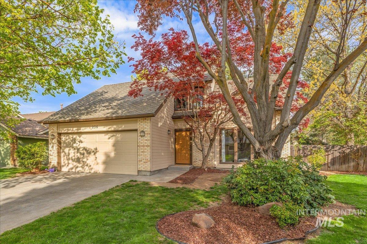 236 East Bayview Court Boise, ID 83706 - Photo 48 of 49 View of front of property with a garage, brick siding, driveway, and a shingled roof