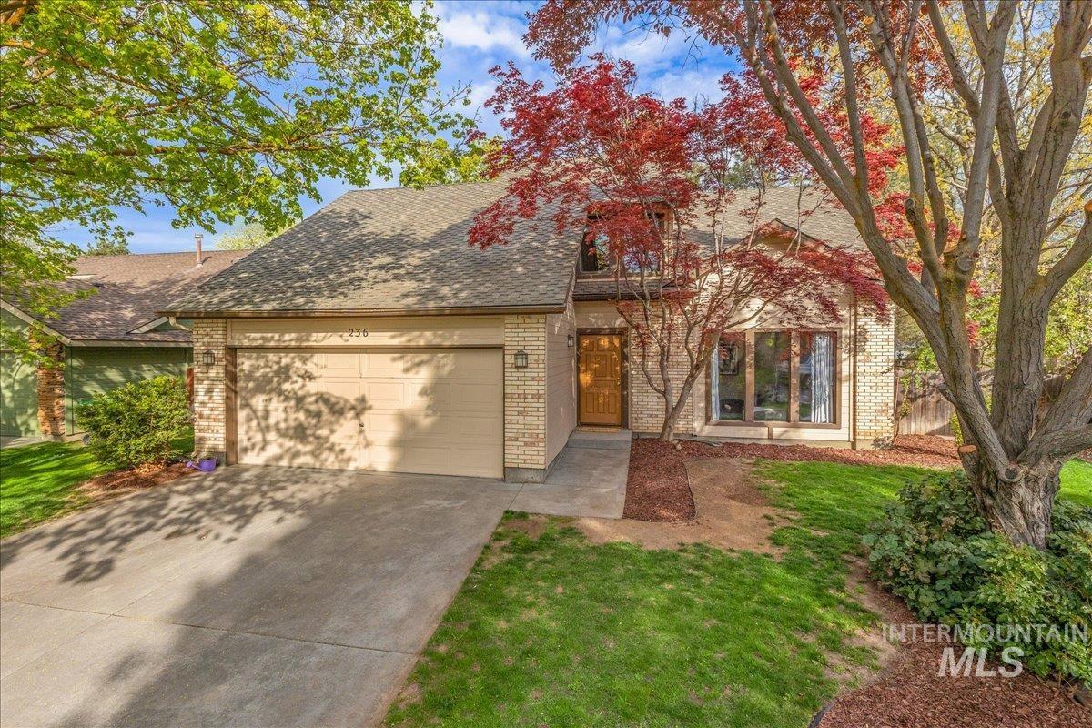 236 East Bayview Court Boise, ID 83706 - Photo 49 of 49 View of front of property featuring driveway, a garage, brick siding, and roof with shingles