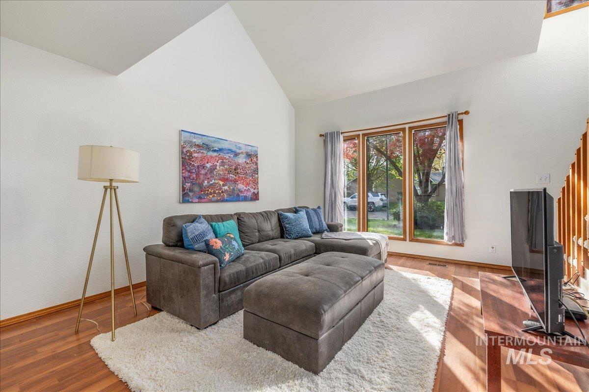 236 East Bayview Court Boise, ID 83706 - Photo 6 of 49 Living room with wood finished floors and vaulted ceiling