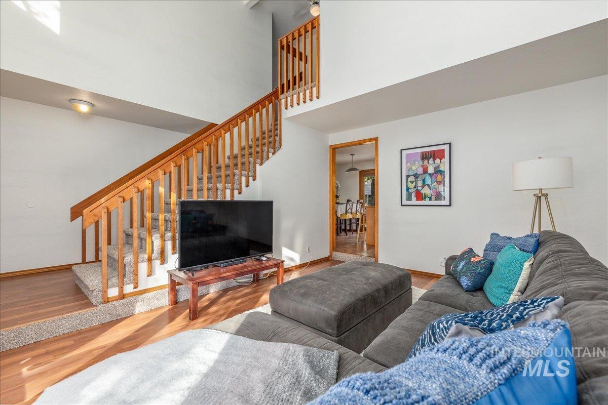 236 East Bayview Court Boise, ID 83706 - Photo 8 of 49 Living area with a high ceiling and wood finished floors