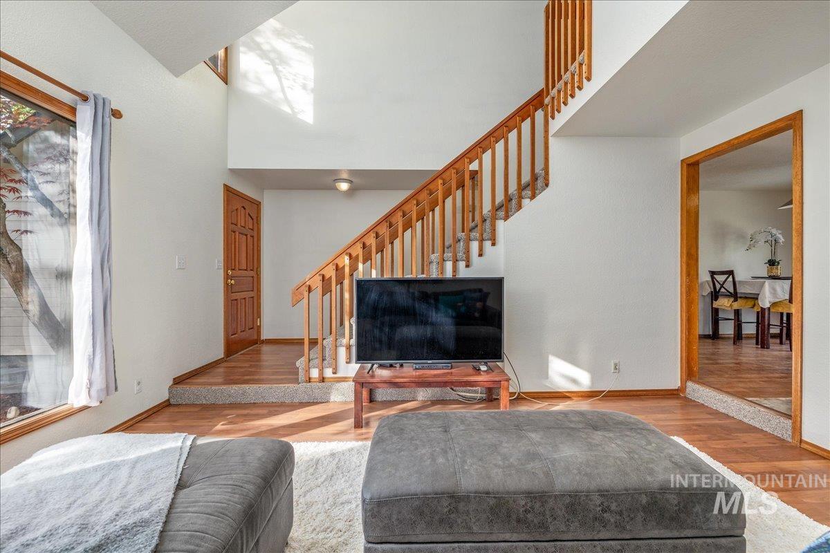 236 East Bayview Court Boise, ID 83706 - Photo 9 of 49 Living area with wood finished floors and a high ceiling