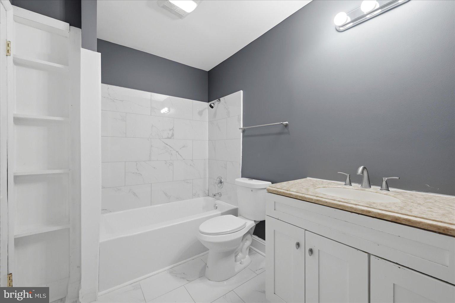 3571 Catlett Road Catlett, VA 20119 - Photo 10 of 22 a bathroom with a granite countertop sink a toilet and shower