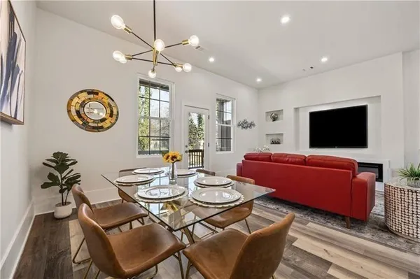 a view of a livingroom with furniture and a flat screen tv