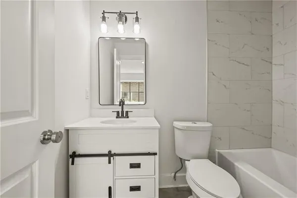 a view of a chairs and table in the balcony