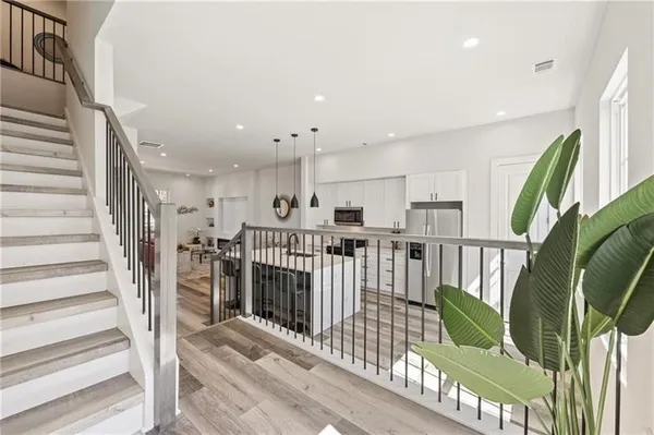 a view of entryway with wooden floor