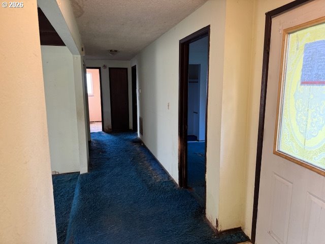 560 St John Street Sutherlin, OR 97479 - Photo 15 of 43 a view of a hallway with wooden floor