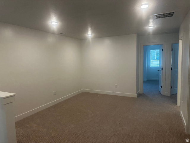 15 South Lunar Way Mapleton, UT 84664 - Photo 9 of 13 Spare room featuring baseboards and dark carpet