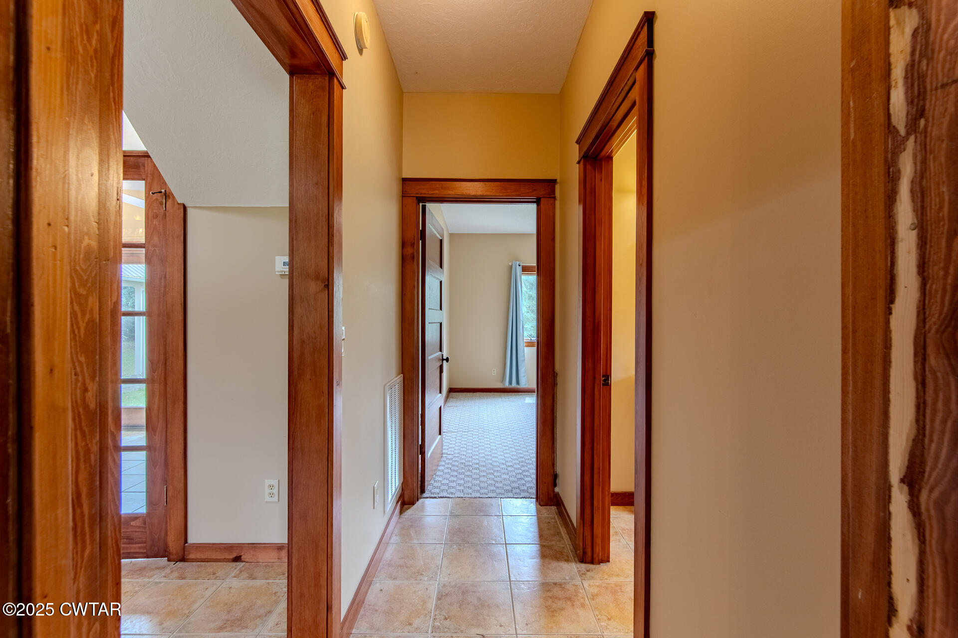 3554 Shades Bridge Road Greenfield, TN 38230 - Photo 31 of 49 a view of a hallway with wooden floor and glass door