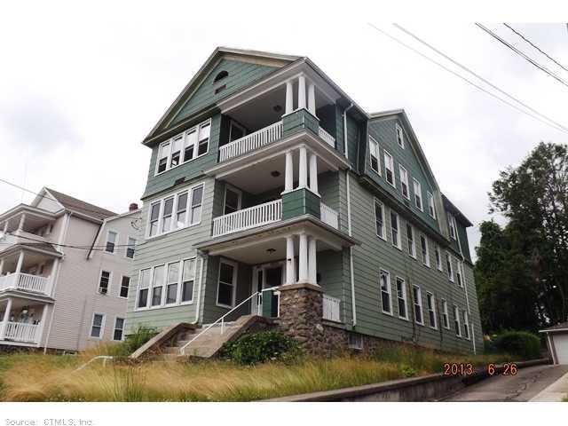 227 Alder Street Waterbury, CT 06708 - Photo 1 of 1 a view of a big building with many windows