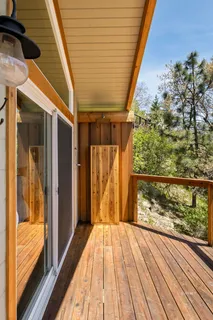 a view of balcony with wooden floor