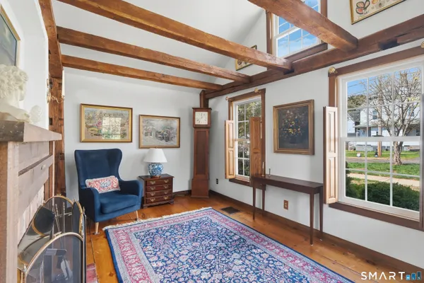 a living room with furniture and a rug