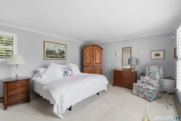 a bedroom with a bed and dresser