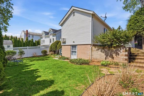 a view of backyard with a garden and plants
