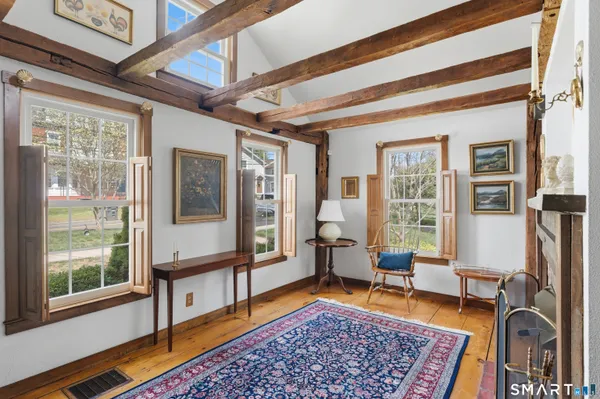 a living room with furniture rug and a table