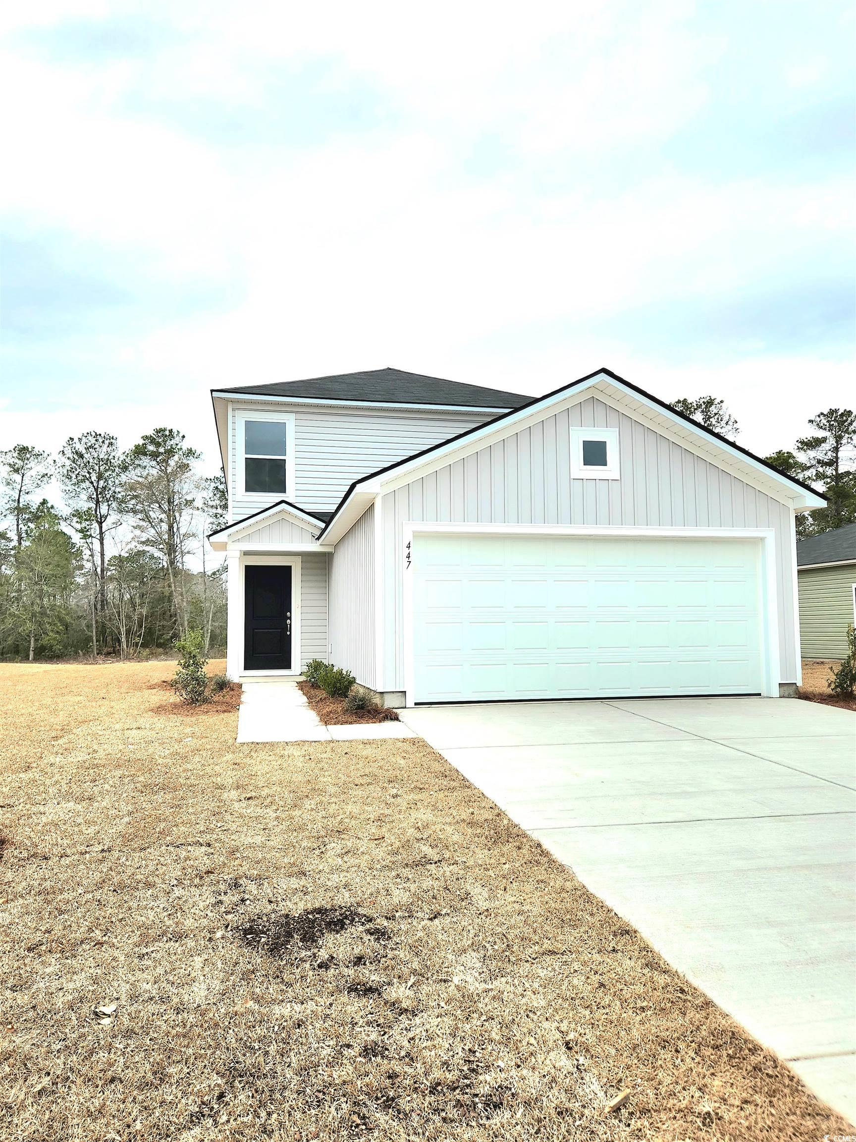 447 Ribbon Rail Way Loris, SC 29569 - Photo 2 of 16 View of front facade with a garage