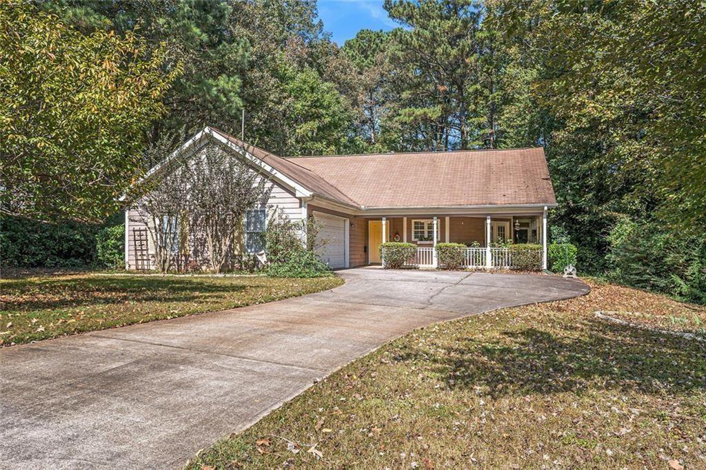 45 Saratoga Way Covington, GA 30016 - Photo 1 of 29 a view of a house with a yard and large tree