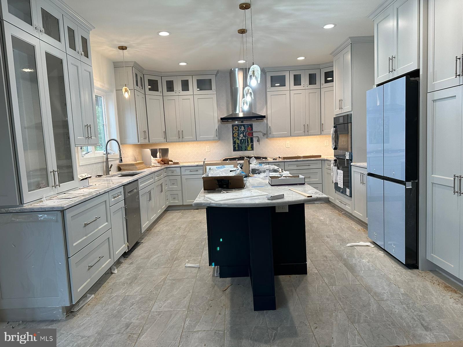 66 Kirk Road Garnet Valley, PA 19060 - Photo 12 of 37 a kitchen with stainless steel appliances granite countertop a sink stove and refrigerator