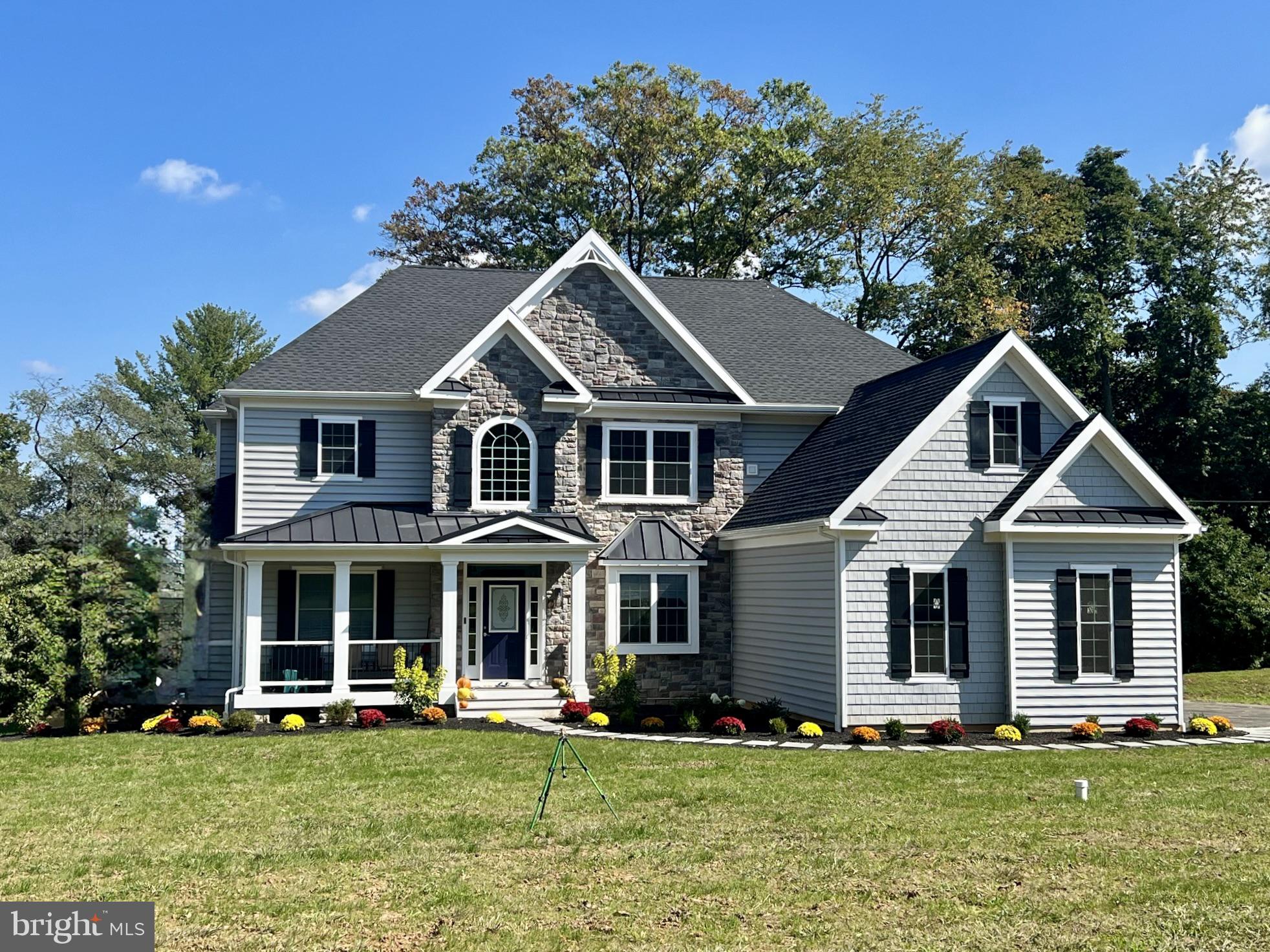 66 Kirk Road Garnet Valley, PA 19060 - Photo 6 of 37 a front view of a house with a yard