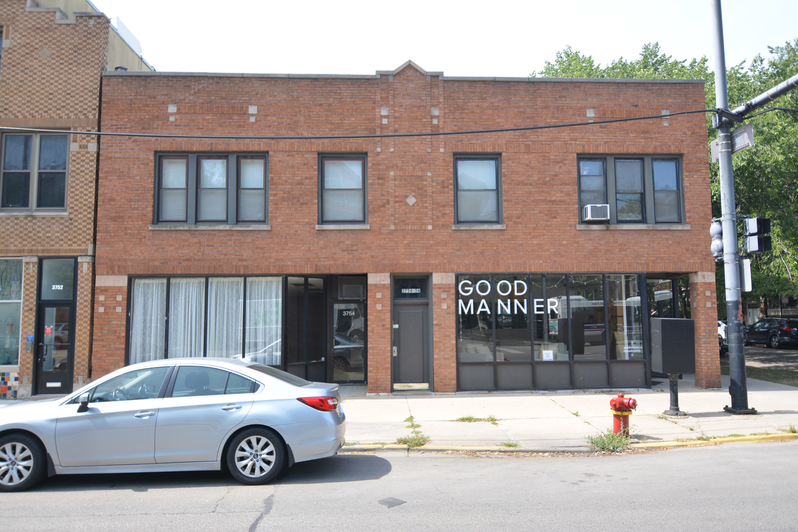 1609 West Grace Street, Unit 2 Chicago, IL 60613 - Photo 1 of 10 a car parked in front of a building