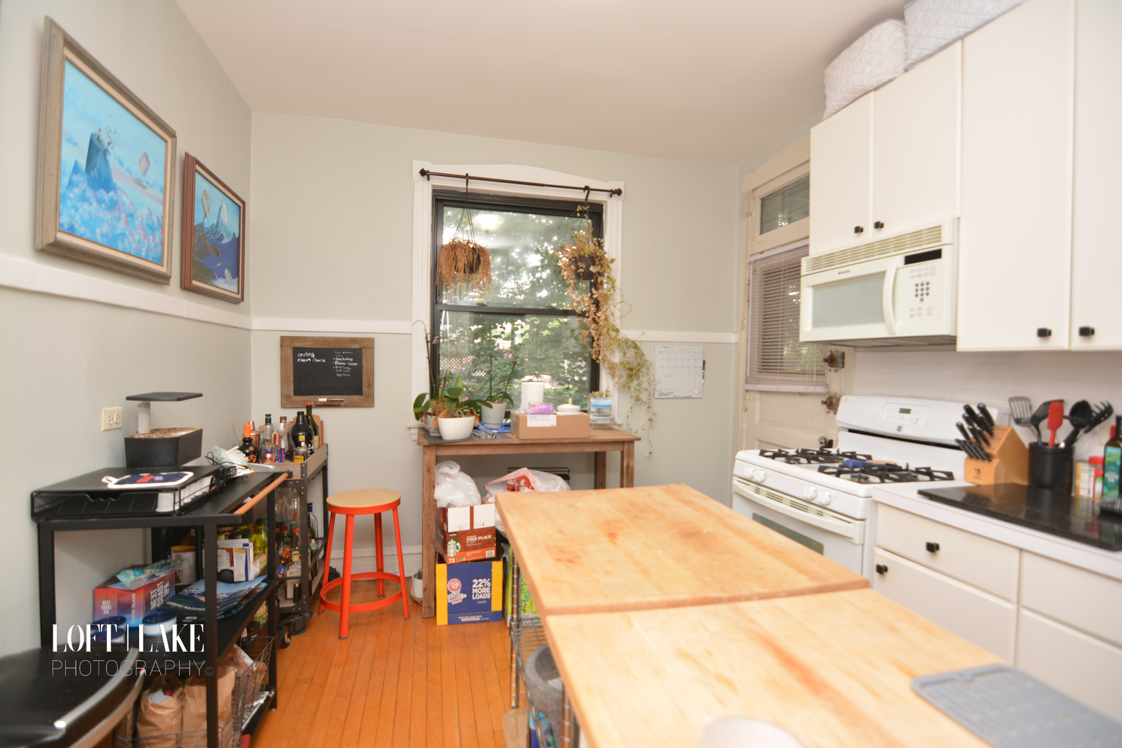 1609 West Grace Street, Unit 2 Chicago, IL 60613 - Photo 7 of 10 a kitchen with stainless steel appliances a stove a sink and a refrigerator
