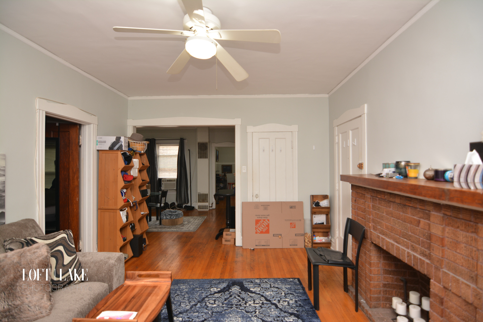 1609 West Grace Street, Unit 2 Chicago, IL 60613 - Photo 9 of 10 a living room with furniture and a fireplace
