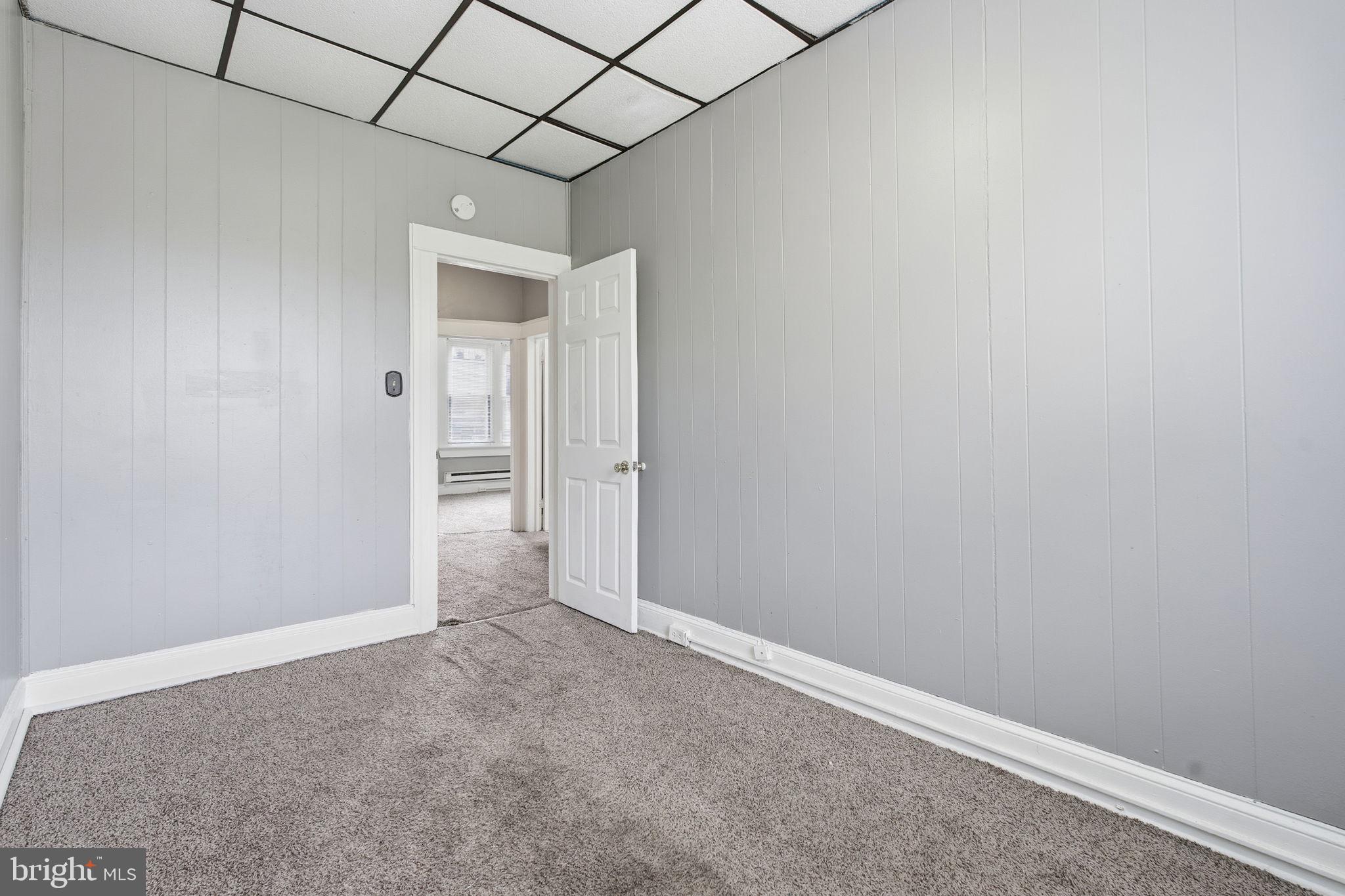 5 South Wickham Road Baltimore, MD 21229 - Photo 18 of 28 a view of an empty room with a window