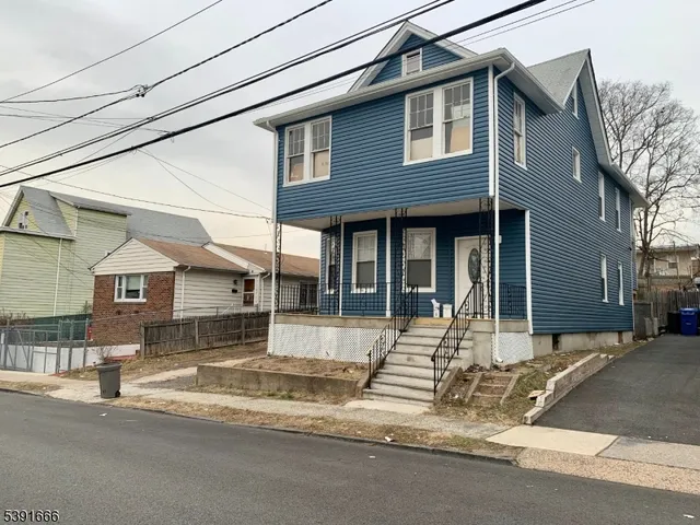 a front view of a house with a garage
