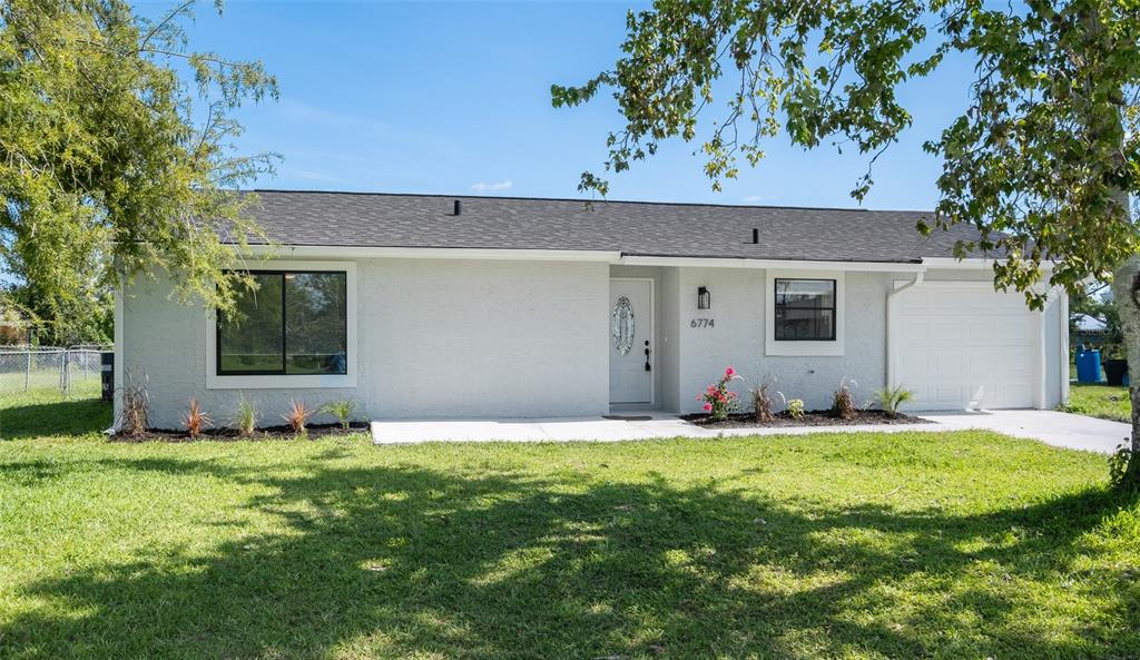 6774 Myrtlewood Road North Port, FL 34287 - Photo 1 of 1 a view of a house with a yard