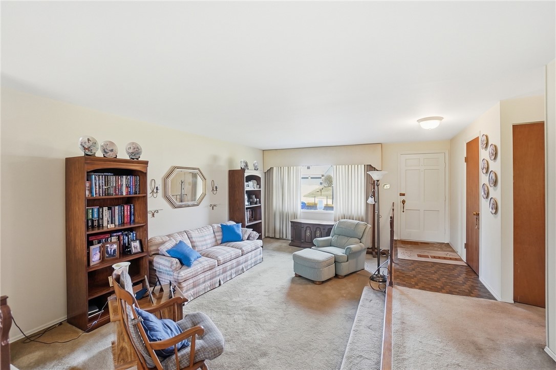 6225 Possum Run Road Bellbrook, OH 45305 - Photo 5 of 33 This inviting living room features warm neutral tones and ample natural light, perfect for everyday living.