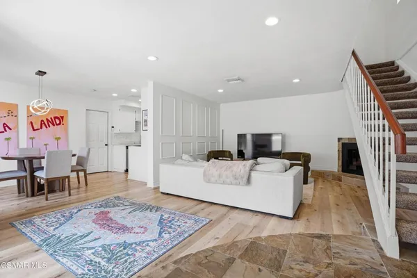 a living room with furniture and a rug