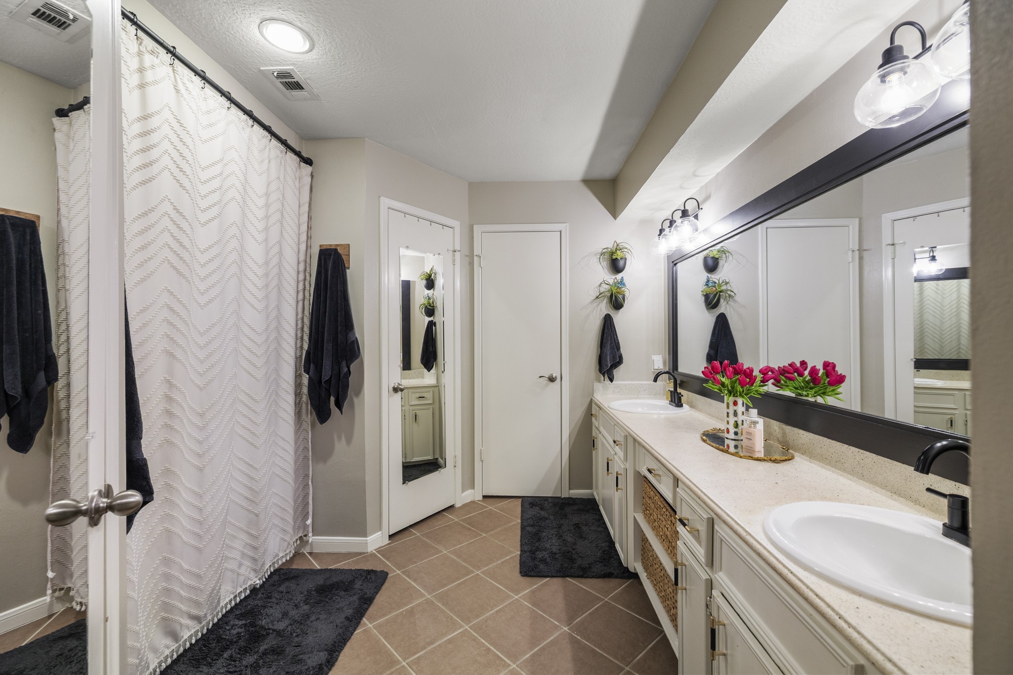17627 Forest Mist Drive Spring, TX 77379 - Photo 19 of 32 The primary bathroom, with dual sinks and his and hers closets.