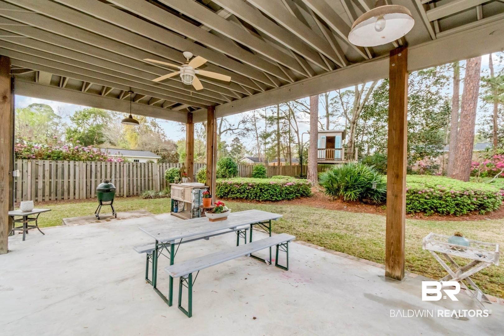 154 Fenwick Road Mobile, AL 36608 - Photo 40 of 48 Fenced backyard featuring a patio, ceiling fan, and outdoor dining area