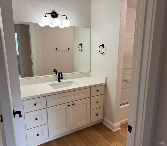 a bathroom with a sink toilet and a vanity