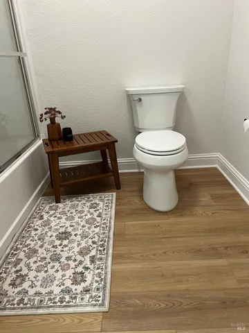 a bathroom with a tub and a shower