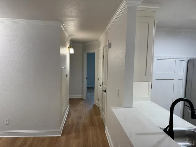 a view of a bathroom from the hallway