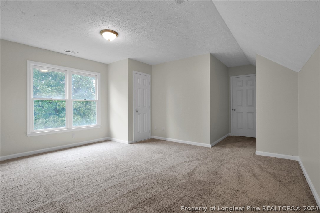 4780 Deer Lakes Road Fayetteville, NC 28311 - Photo 30 of 36 an empty room with windows and closet
