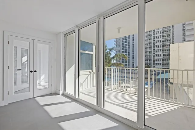 a view of a kitchen with a refrigerator and cabinet