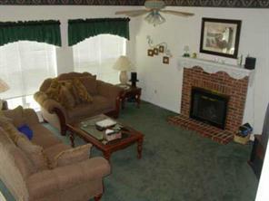 6937 Reedy Creek Road Charlotte, NC 28215 - Photo 3 of 8 a living room with furniture and a fireplace