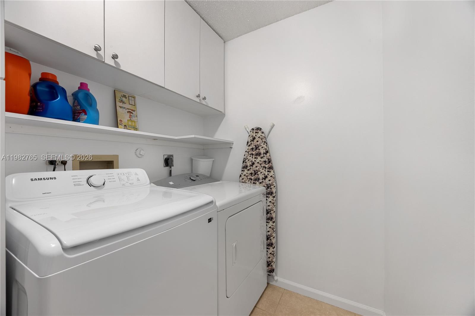 8962 Southeast Riverfront Terrace Jupiter, FL 33469 - Photo 17 of 20 a utility room with dryer and washer