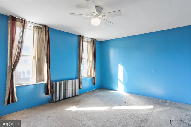 a view of entryway and hall with a window