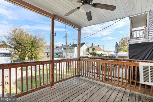 a view of a balcony with wooden floor