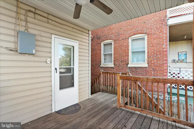 a view of a house with wooden deck