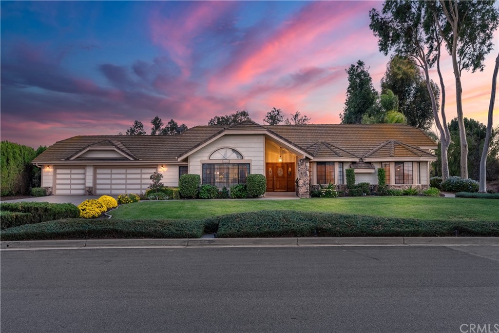 16611 Tava Lane Riverside, CA 92504 - Photo 1 of 1 a front view of a house with a garden and deck