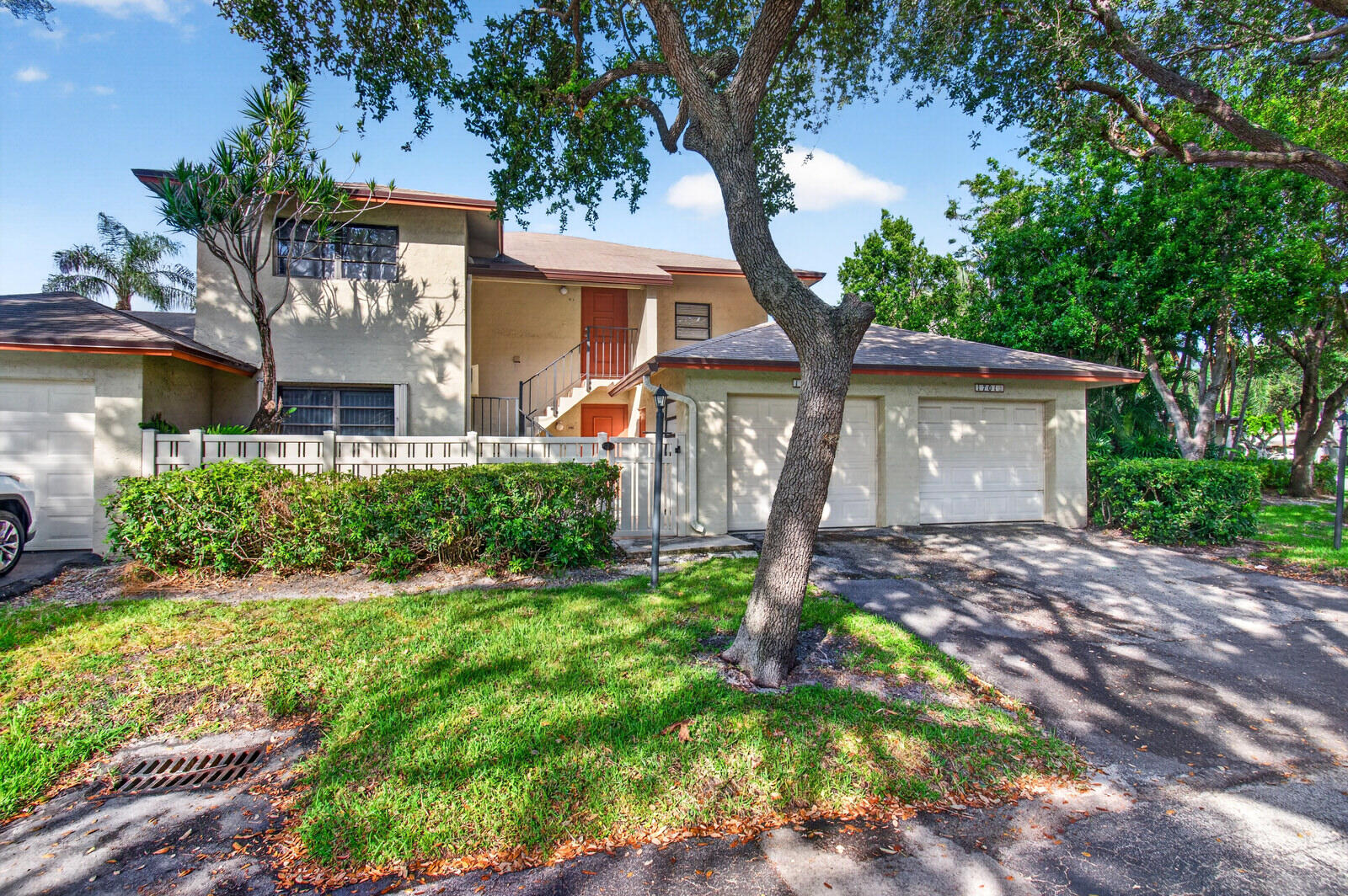 3951 Northeast 19th Road, Unit 1701 Pompano Beach, FL 33064 - Photo 67 of 82 a front view of a house with a yard and garage