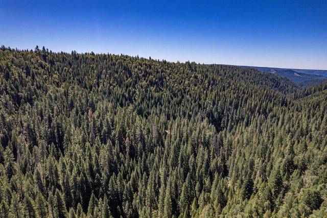 a view of a town with mountains in the background