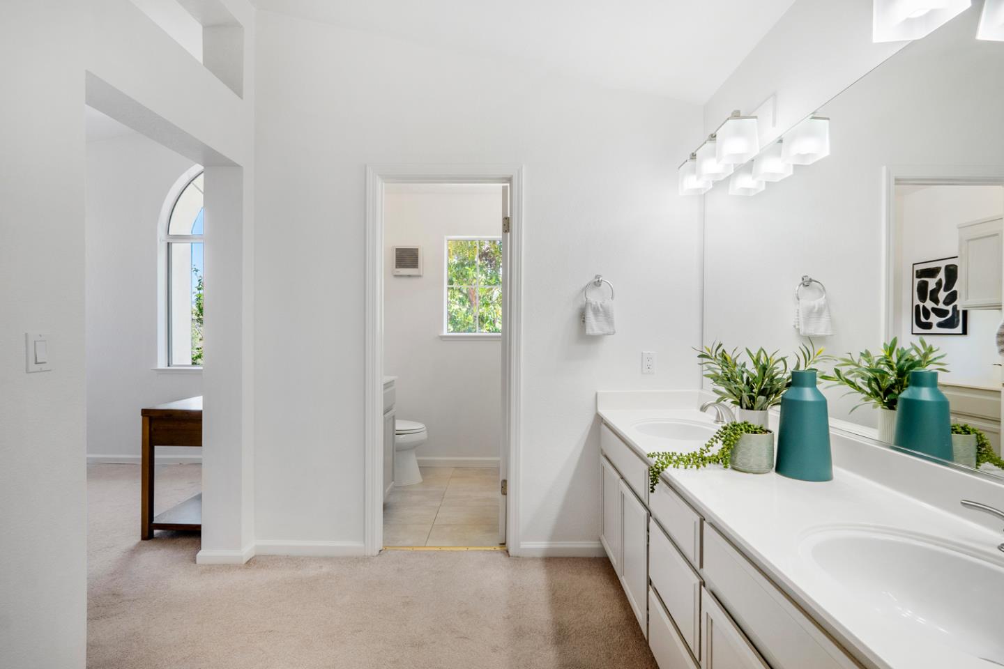 581 Eden Street Gilroy, CA 95020 - Photo 14 of 40 a spacious bathroom with a granite countertop sink a toilet and a mirror
