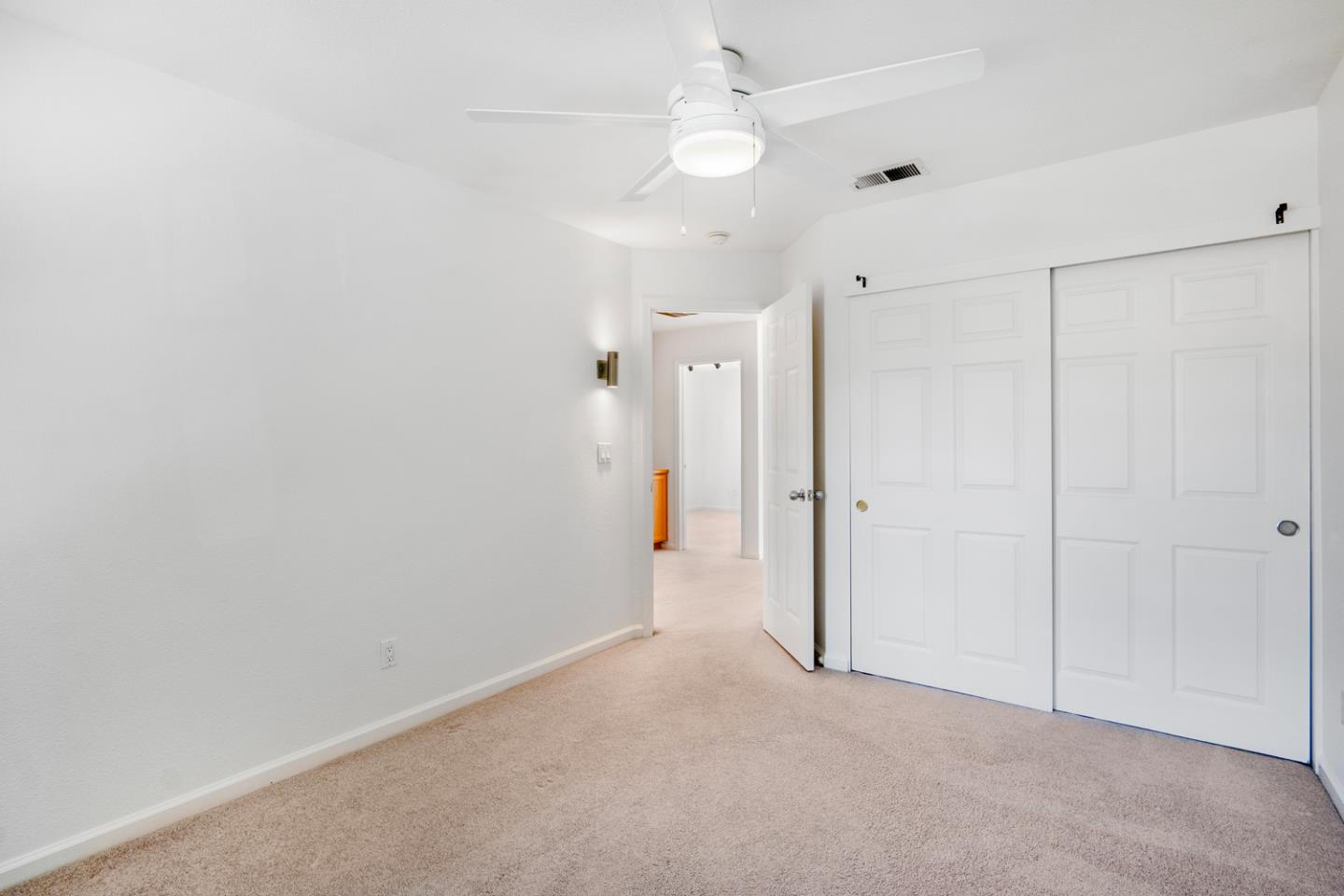 581 Eden Street Gilroy, CA 95020 - Photo 22 of 40 an empty room with a ceiling fan and a window